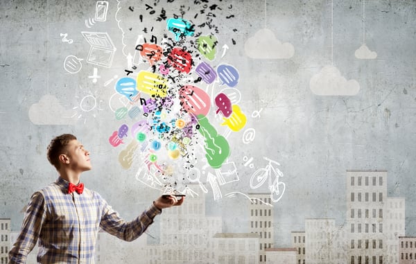 Young man with mobile phone and colorful chat icons